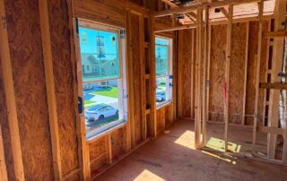 Framed interior room prior to batt insulation installation in a new construction DRB Homes home in Stockbridge, GA by Foster Insulation.