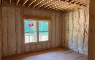 Foster Insulation batt insulation installed in a bedroom wall around a window in Blue Ridge, GA.