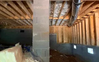 Foster Insulation batt insulation installed between crawlspace floor joists in Blue Ridge, GA.