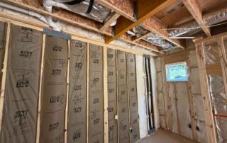 Foster Insulation kraft-faced fiberglass batts installed in lower-level framed walls of a custom home in Cobb County, GA.