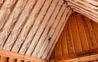 Foster Insulation open-cell spray foam applied to the roof rafters of a vaulted ceiling in a custom home in Cobb County, GA.