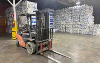 Forklift in front of stacked bagged insulation inventory at the Foster Insulation Fort Oglethorpe, GA branch warehouse.