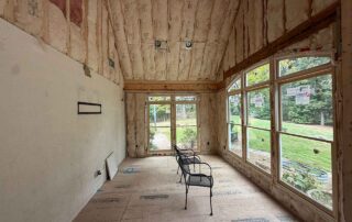 Fiberglass batt insulation installed in a ceiling and walls during a residential remodel.