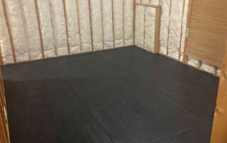 Fiberglass batt insulation installed in the walls of a room of a residential remodel.